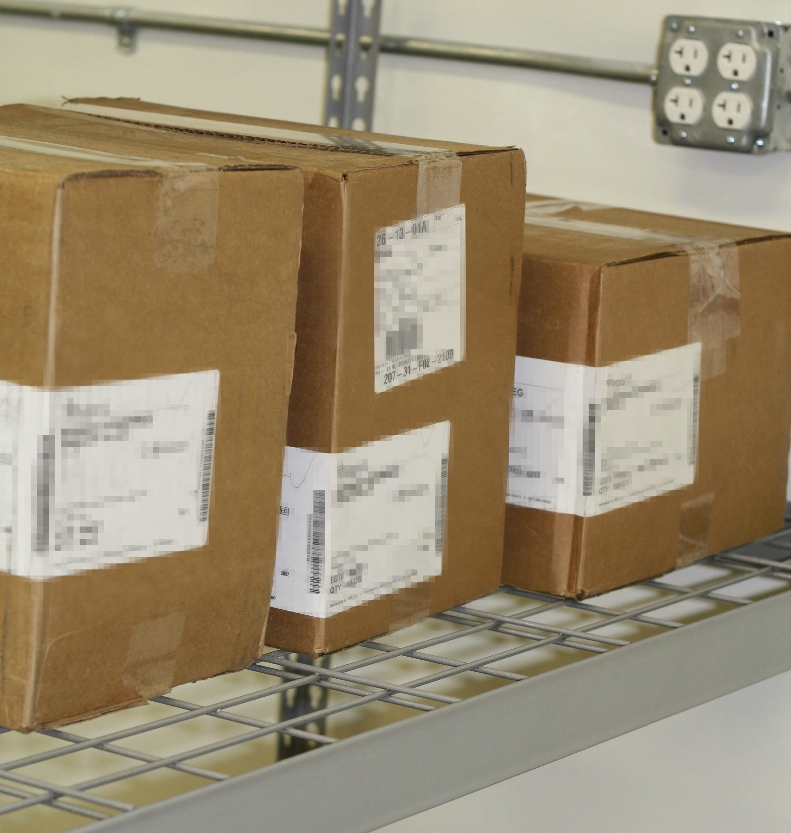Boxes on shelf with blurred labels